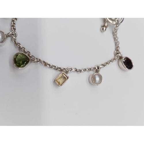 827 - A Silver Peridot and Citrine Bracelet. 18cm. 12.6g