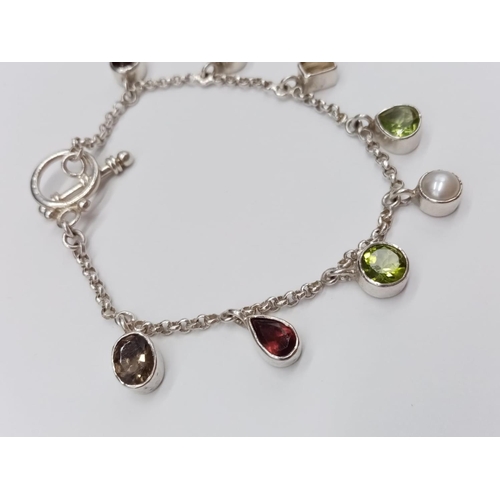 827 - A Silver Peridot and Citrine Bracelet. 18cm. 12.6g