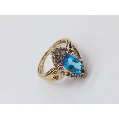 852 - 10K Topaz and diamond ring. 4.15g and Size O