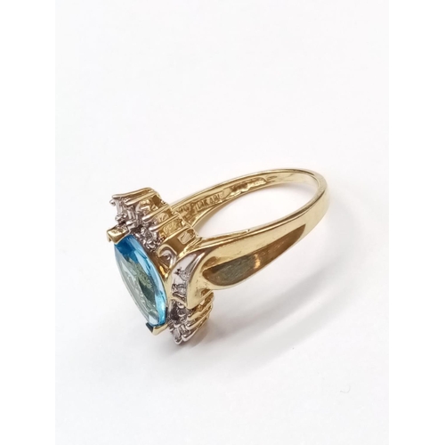 852 - 10K Topaz and diamond ring. 4.15g and Size O