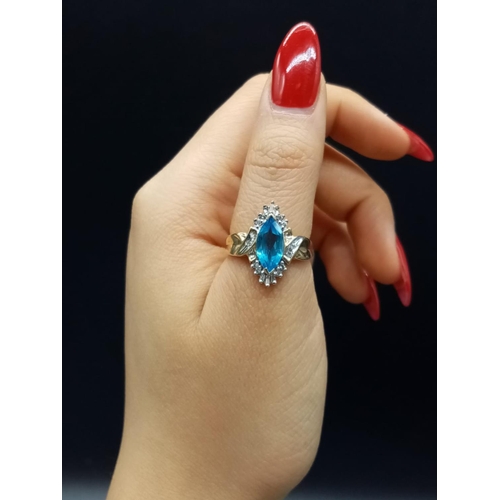 852 - 10K Topaz and diamond ring. 4.15g and Size O