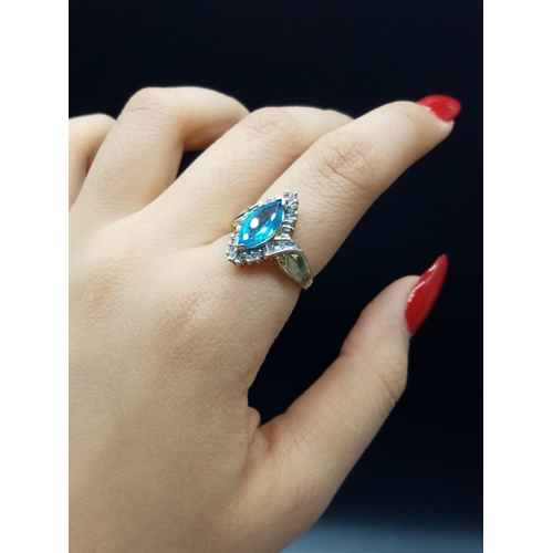 852 - 10K Topaz and diamond ring. 4.15g and Size O