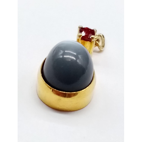 884 - Yellow Metal Ruby and Moonstone PENDANT.  3.37g  2cm drop