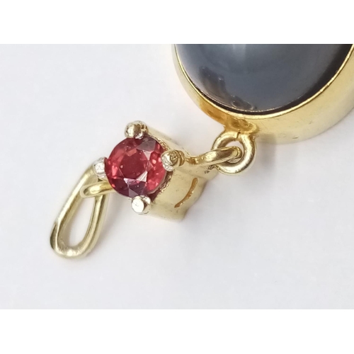 884 - Yellow Metal Ruby and Moonstone PENDANT.  3.37g  2cm drop