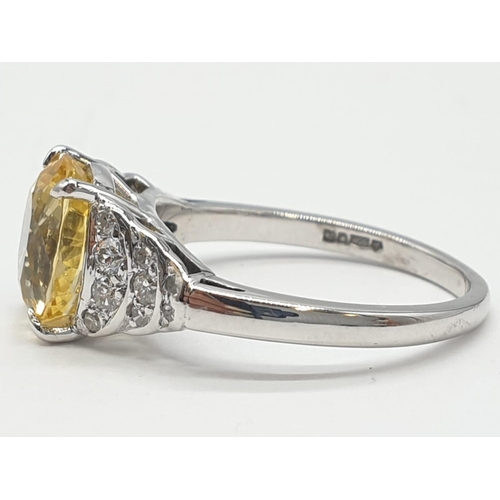 589 - 3.5ct Natural Sri Lankan yellow sapphire shape oval stone in a vintage platinum setting. Weighs 5.3g... 