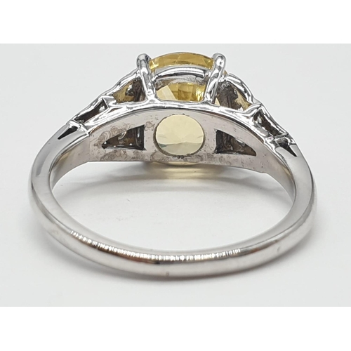 589 - 3.5ct Natural Sri Lankan yellow sapphire shape oval stone in a vintage platinum setting. Weighs 5.3g... 