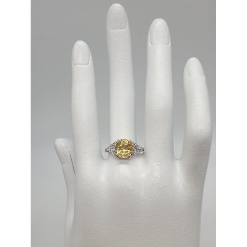 589 - 3.5ct Natural Sri Lankan yellow sapphire shape oval stone in a vintage platinum setting. Weighs 5.3g... 