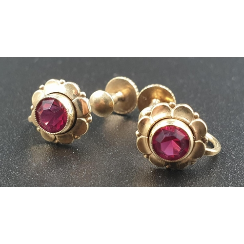 593 - Pair of rolled gold earrings