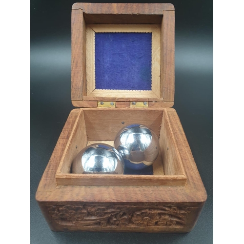 965 - Hand Carved Indian Wooden Box with Two Metal Meditation Balls. 10 x 10cm