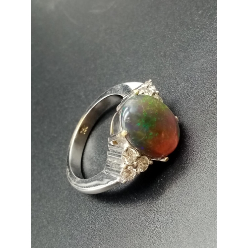 178 - 18ct white gold opal ring, 10x12mm opal centre and diamonds on shoulders, weight 10g and size N1/2