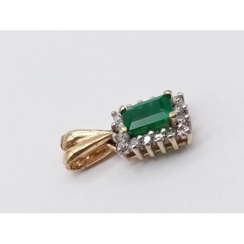 186 - Emerald and diamond pendant in yellow gold setting