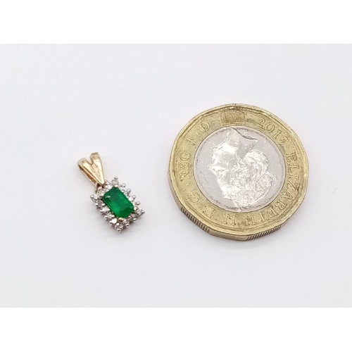 186 - Emerald and diamond pendant in yellow gold setting