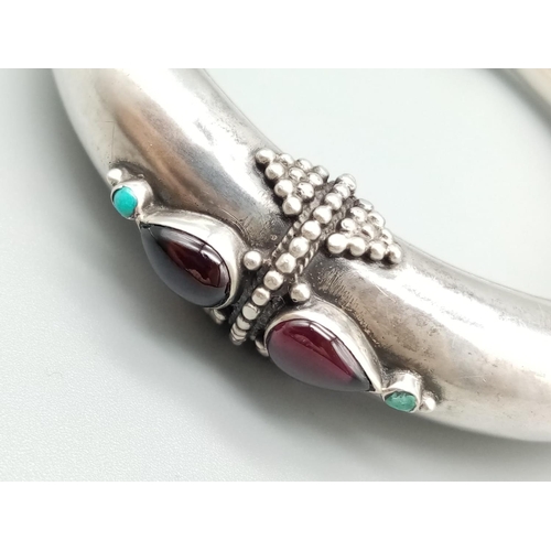 213 - Jewish Silver bangle with garnet and turquoise, weight 49g and 6cm diameter inner width