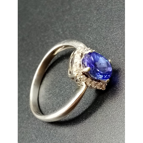 325 - 14ct white gold tanzanite ring, weight 3.37g and size R