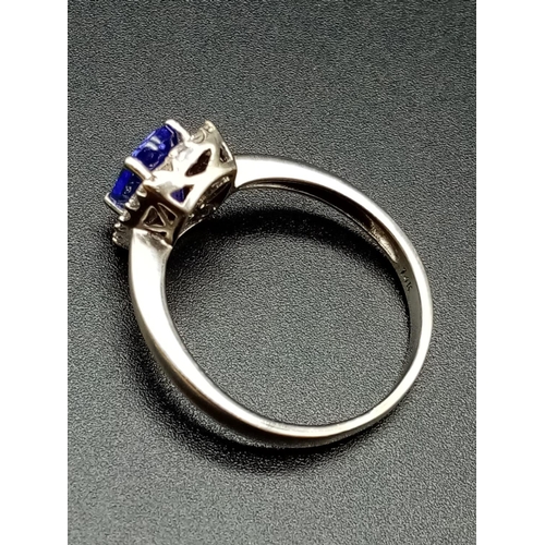 325 - 14ct white gold tanzanite ring, weight 3.37g and size R