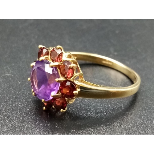 328 - 9ct yellow gold garnet and amethyst ring, weight 2.88g and size P