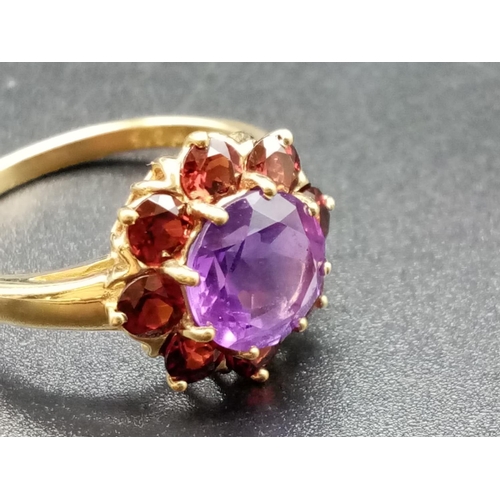 328 - 9ct yellow gold garnet and amethyst ring, weight 2.88g and size P