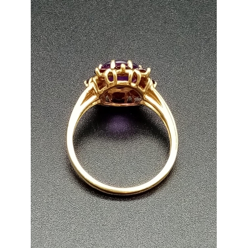 328 - 9ct yellow gold garnet and amethyst ring, weight 2.88g and size P