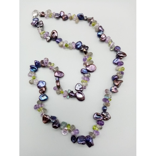 395 - Pearl, amethyst and peridot necklace set in silver clasp, weight 28g 50cm long