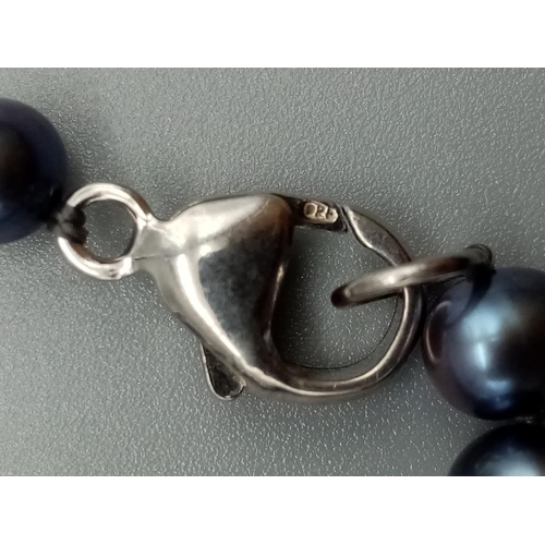 396 - Black pearl necklace silver clasp, weight 19g and 46cm long approx