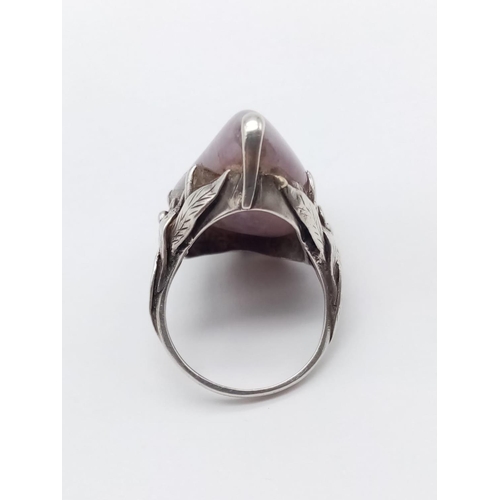 532 - Silver handmade ring with large purple stone, weight 9g and size M