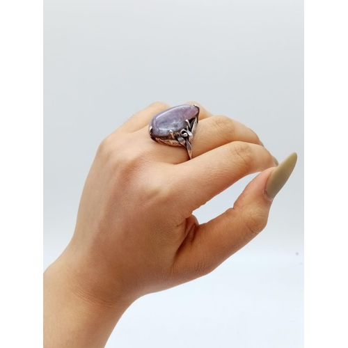 532 - Silver handmade ring with large purple stone, weight 9g and size M