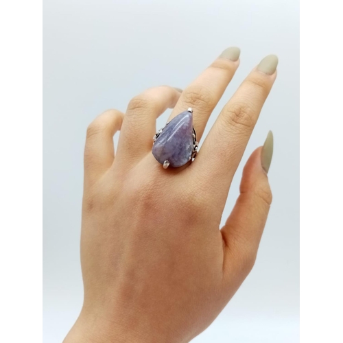 532 - Silver handmade ring with large purple stone, weight 9g and size M