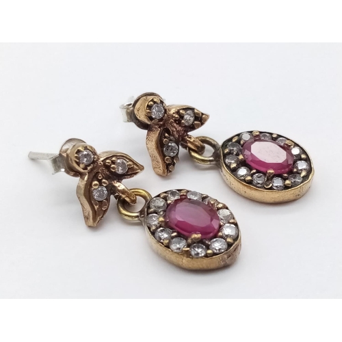 597 - Silver gilt red and white stone earrings, weight 4g