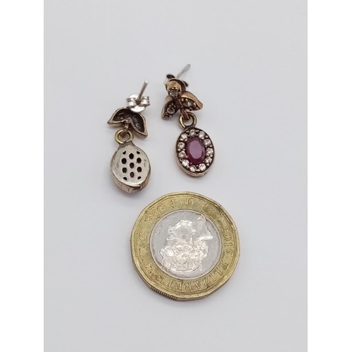 597 - Silver gilt red and white stone earrings, weight 4g