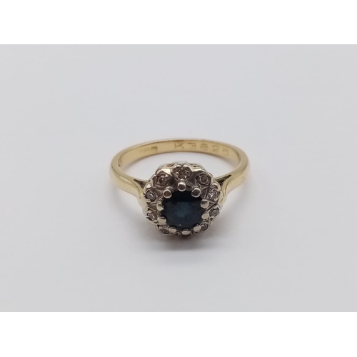 123 - 18CT YELLOW GOLD DIAMOND AND SAPPHIRE CLUSTER RING, WEIGHT 3.6G SIZE K1/2