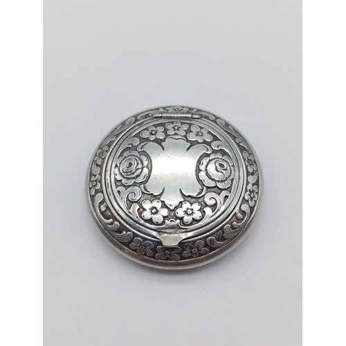 205 - German silver mini compact with floral engraves, weight 23g and 5cm diameter approx