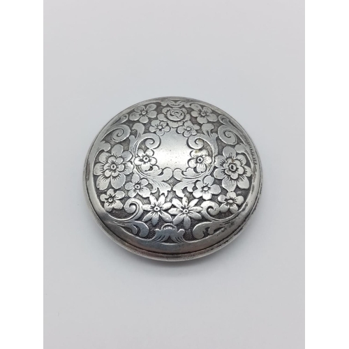 205 - German silver mini compact with floral engraves, weight 23g and 5cm diameter approx