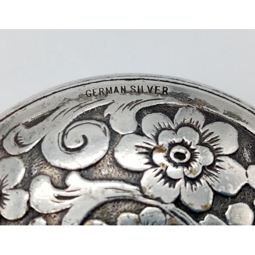 205 - German silver mini compact with floral engraves, weight 23g and 5cm diameter approx