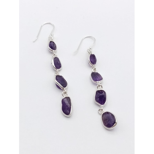 433 - A raw amethyst gemstone necklace with matching dangler earrings in 925 silver