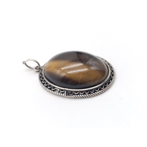 511 - Tiger eye silver vintage pendant, weight 7.9g and 3.5cm drop