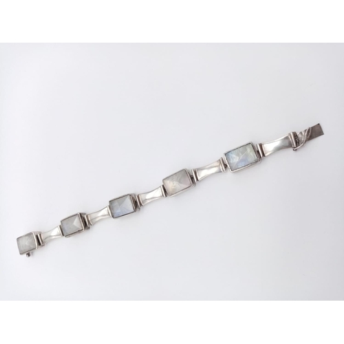 524 - Moonstone silver bracelet, weight 30g and 18cm long approx