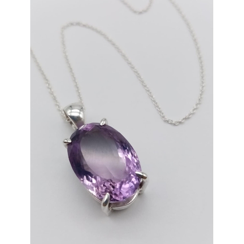 530 - An amethyst Ring  and matching pendant in 925 silver