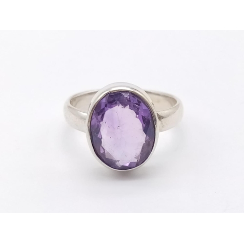 530 - An amethyst Ring  and matching pendant in 925 silver