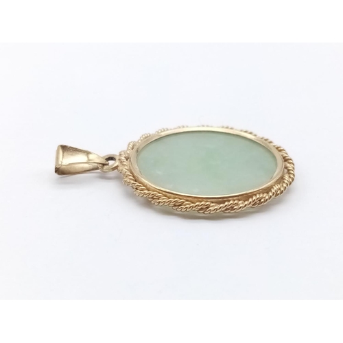 613 - Jade pendant set in 9ct yellow gold, weight 4g