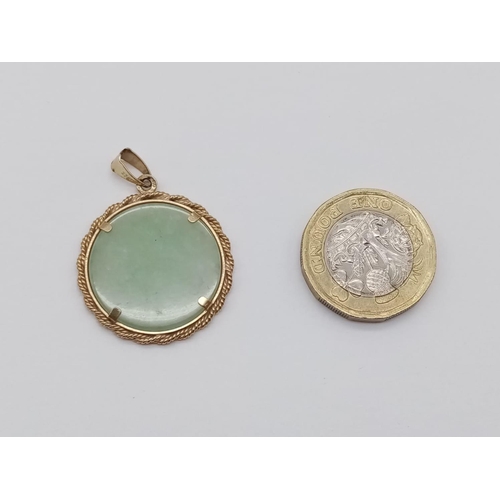 613 - Jade pendant set in 9ct yellow gold, weight 4g