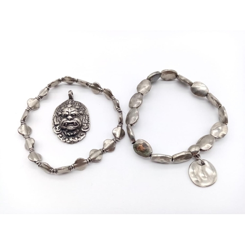 658 - Two bracelet and a God pendant, weight 42g