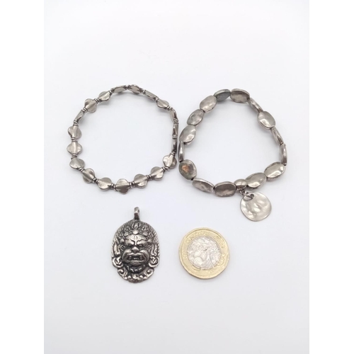 658 - Two bracelet and a God pendant, weight 42g