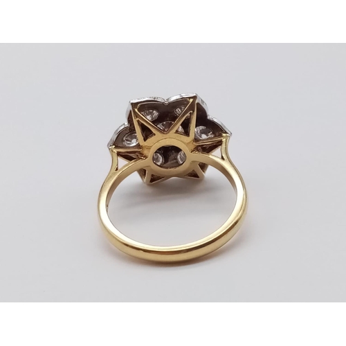 87 - AN 18ct GOLD RING WITH 1.08CT OF BRILLIANT DIAMONDS FORMING A PRETTY FLORAL EFFECT.
6.00gms   SIZE O