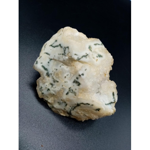 873 - A Large Crystal Specimen with Roquefort-like veins.  7 x 6cm. 124g.