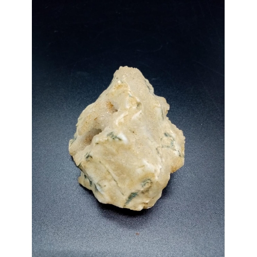 873 - A Large Crystal Specimen with Roquefort-like veins.  7 x 6cm. 124g.