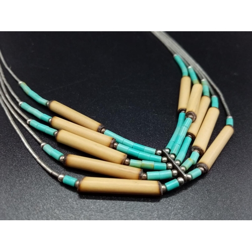 866 - A Silver and turquoise multi-chain necklace. 44cm
10.6g