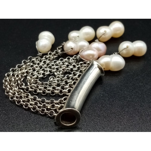 919 - A Silver and Pearl Drop Pendant. 8cm drop. 11.5g