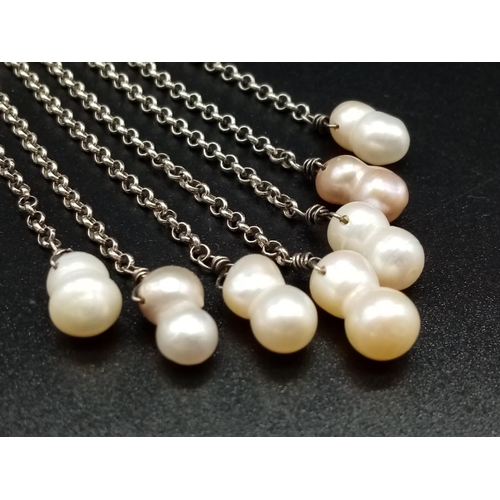 919 - A Silver and Pearl Drop Pendant. 8cm drop. 11.5g