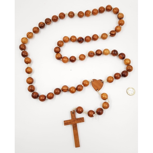 944 - An extremely Long Bead Necklace with Wooden Cross. 150cm