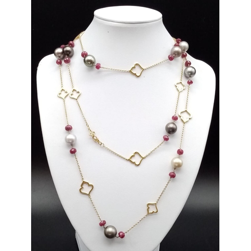 115 - AN 18CT GOLD NECKLACE WITH RUBY AND TAHITION PEARLS MEASURING 125 cms IN LENGTH AND WEIGHING 55.6 gm... 